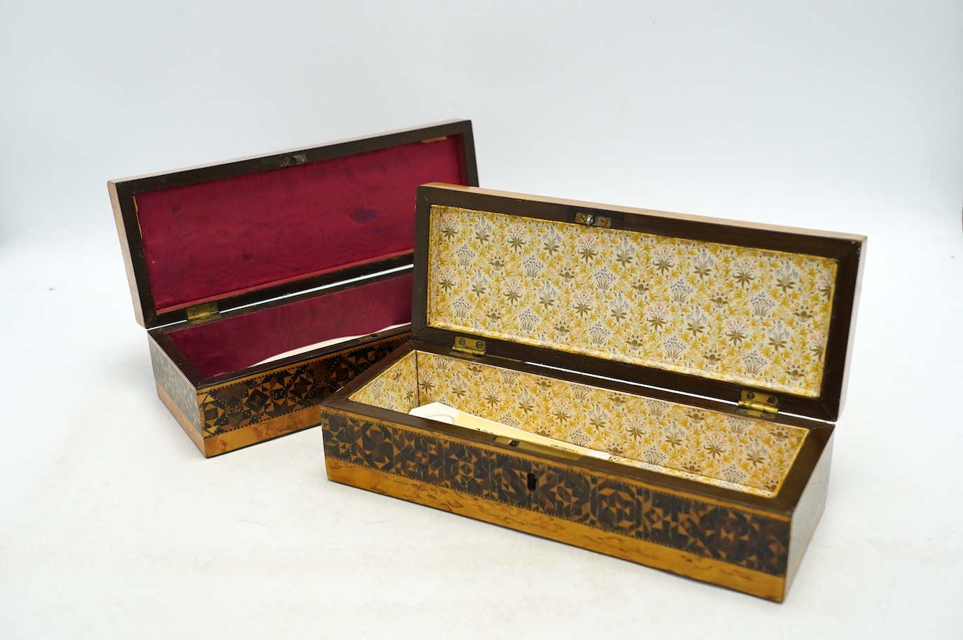Two Tunbridgeware bird's eye maple half square mosaic glove boxes, c.1825-40, one with key, 24cm. Condition - fair to good